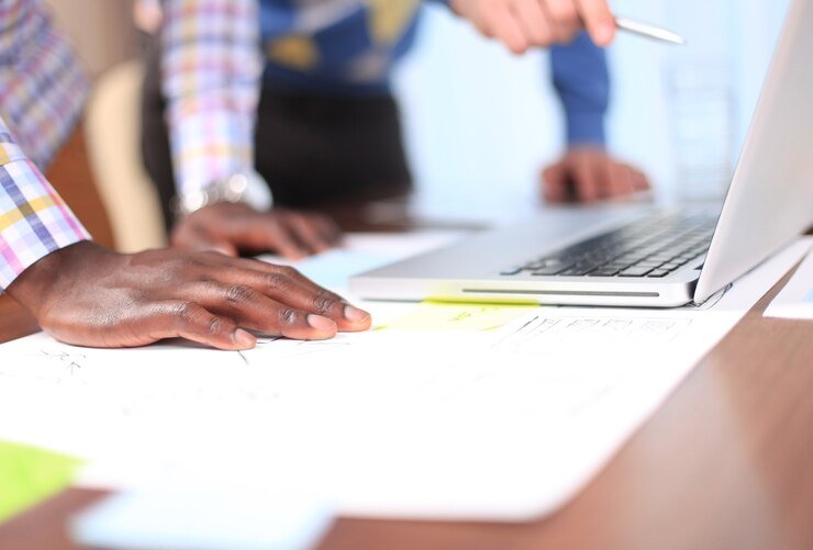 business-adviser-analyzing-financial-figures-denoting-progress-work-company_484651-8838-1-1-1.jpg
